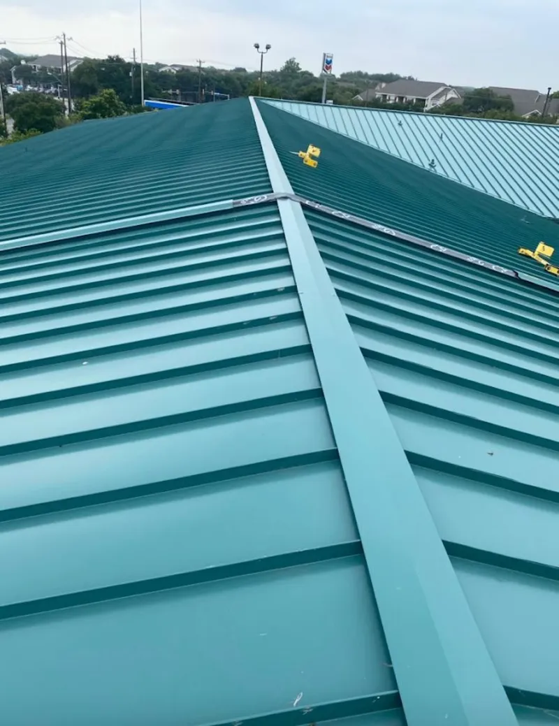 Green commercial metal roof ridge and valley for Metal Roof Repair in Glasgow Village